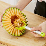 a fruit peeler removing the seeds from half of a cantelope